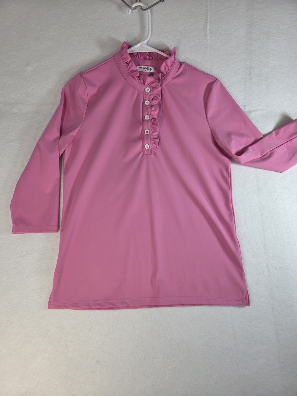 Item Description
Title: The Back Forty Pink Ruffle Neck Golf Polo Shirt Medium